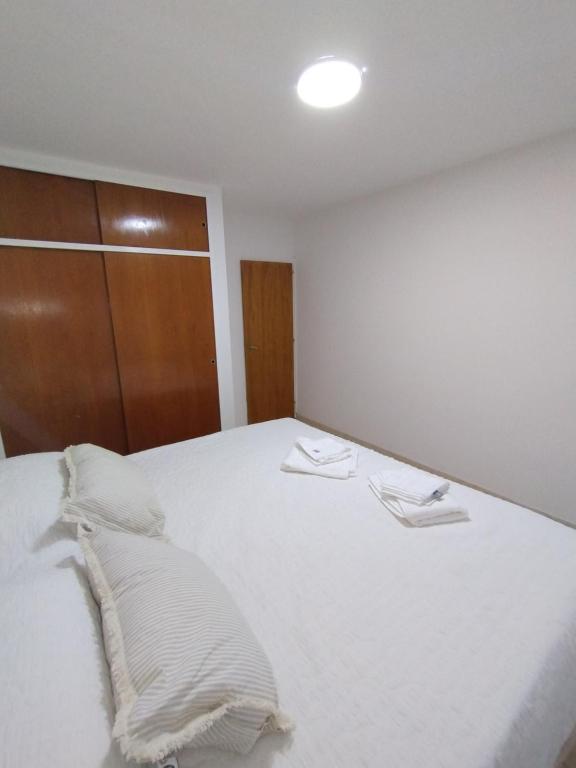 Ένα ή περισσότερα κρεβάτια σε δωμάτιο στο Brisas Patagónicas