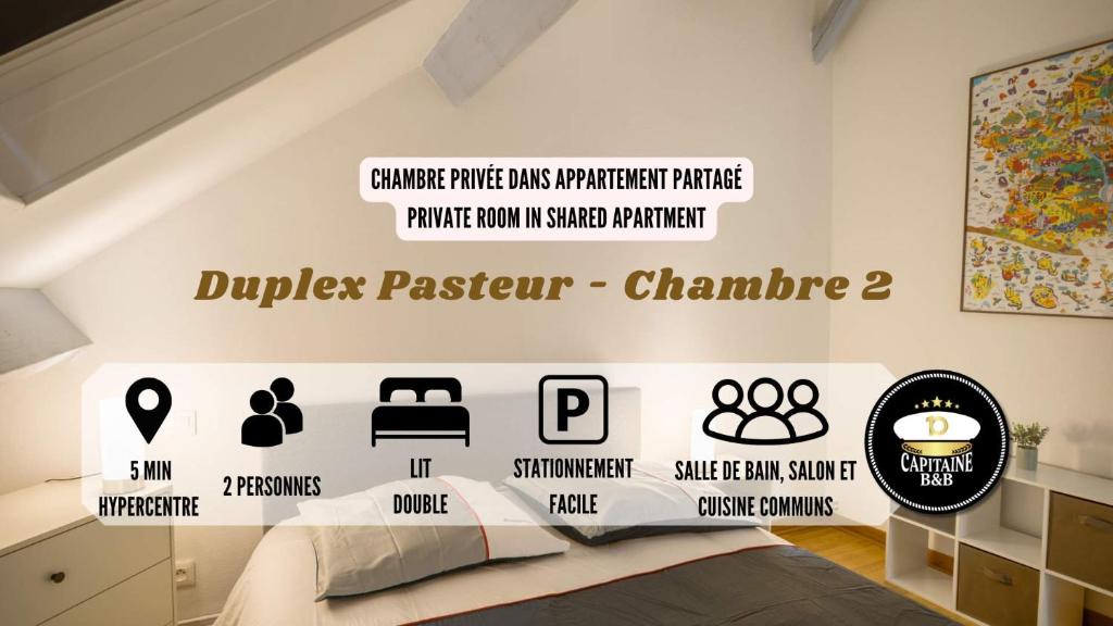 - une chambre dotée d'un lit et d'un mur avec les mots « dudley pascal » dans l'établissement Duplex Pasteur - Chambre 2 - Chambre Privée, à Troyes