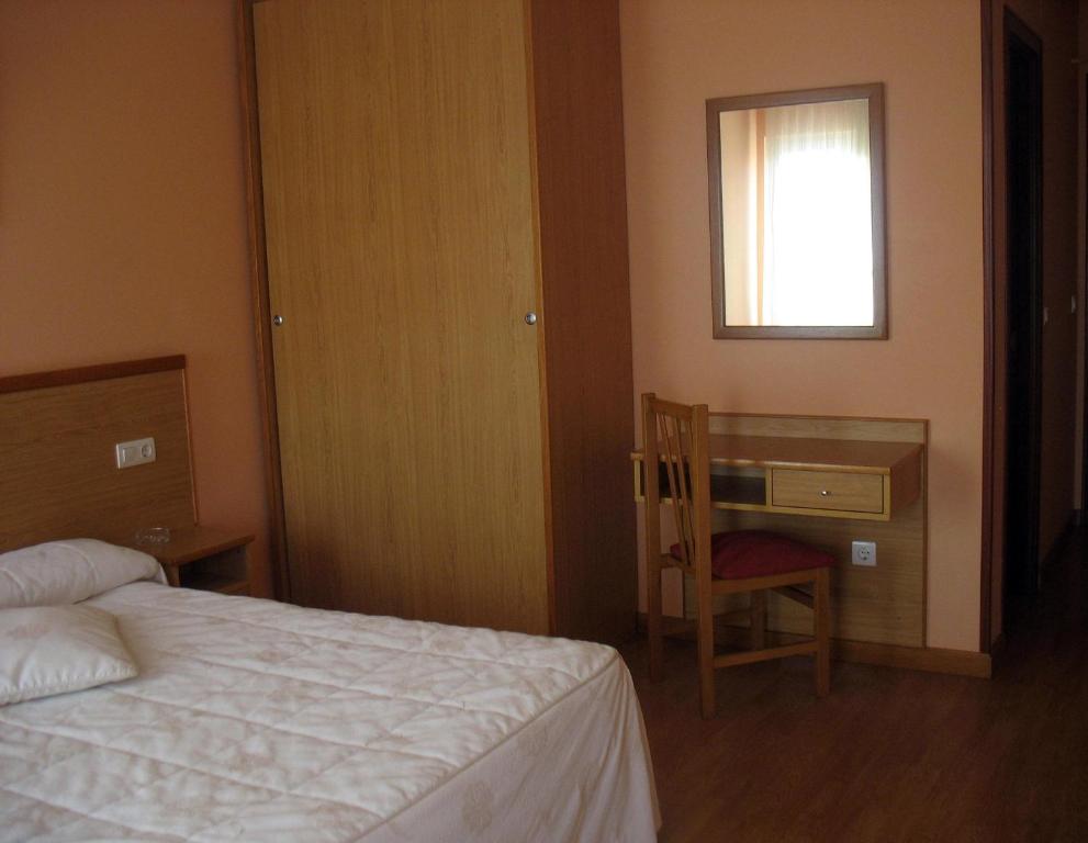 Postel nebo postele na pokoji v ubytování Hotel Reyes De León