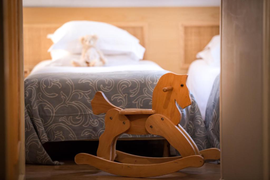 Una cama o camas en una habitación de Hôtel Le Pré Galoffre