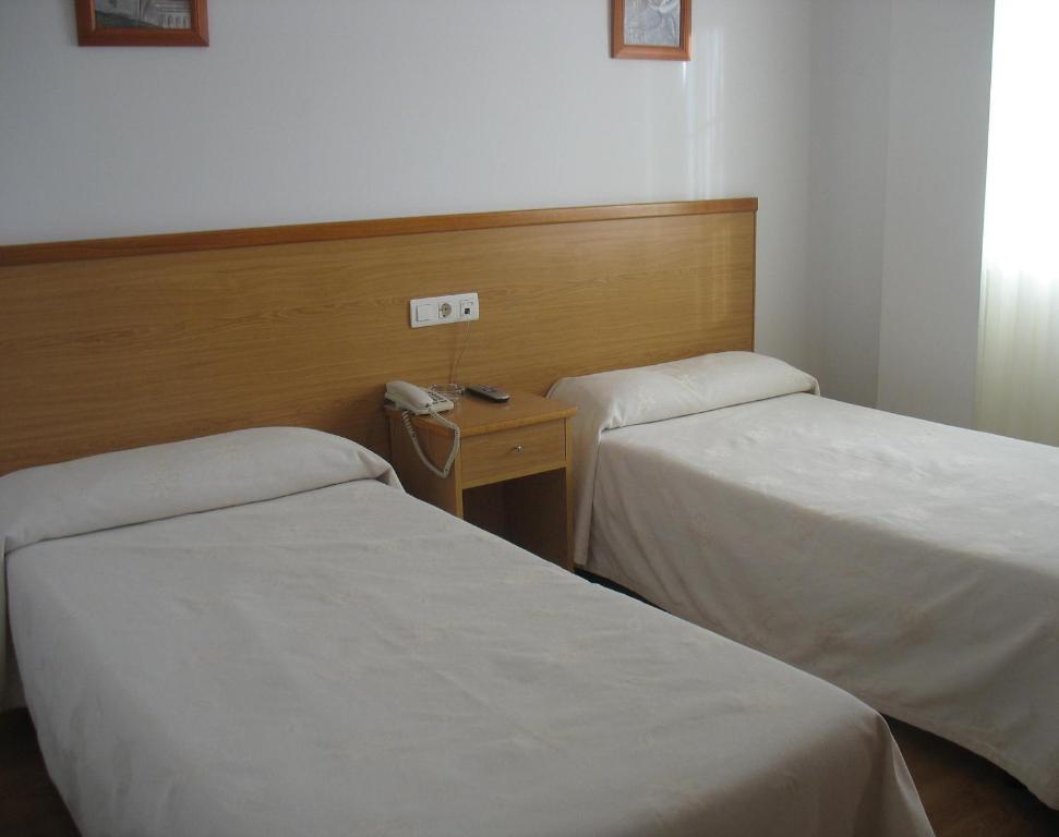 Postel nebo postele na pokoji v ubytování Hotel Reyes De León
