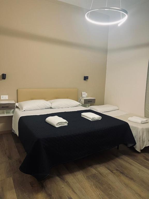 Postel nebo postele na pokoji v ubytování Il Galileo Rooms