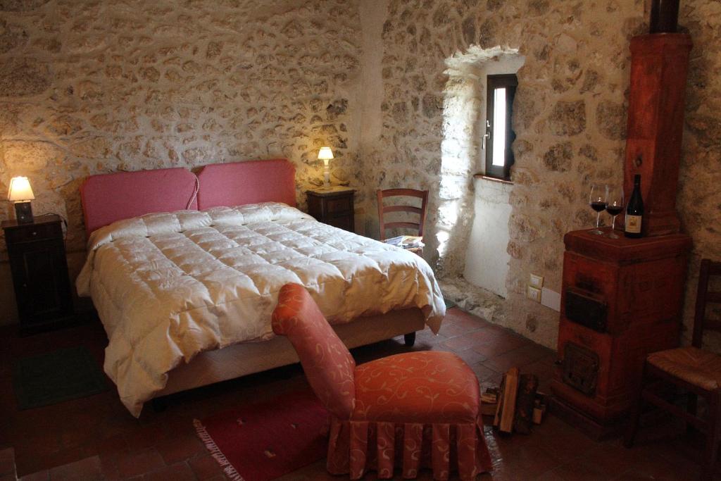 Letto o letti in una camera di Albergo Diffuso - Rocca Calascio