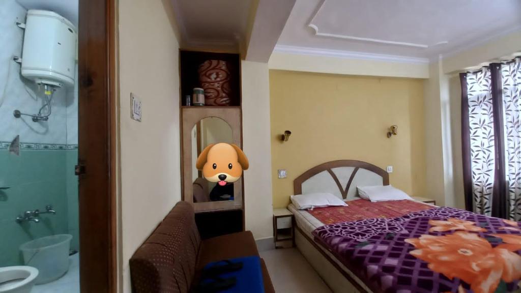Postel nebo postele na pokoji v ubytování Hotel Harbans