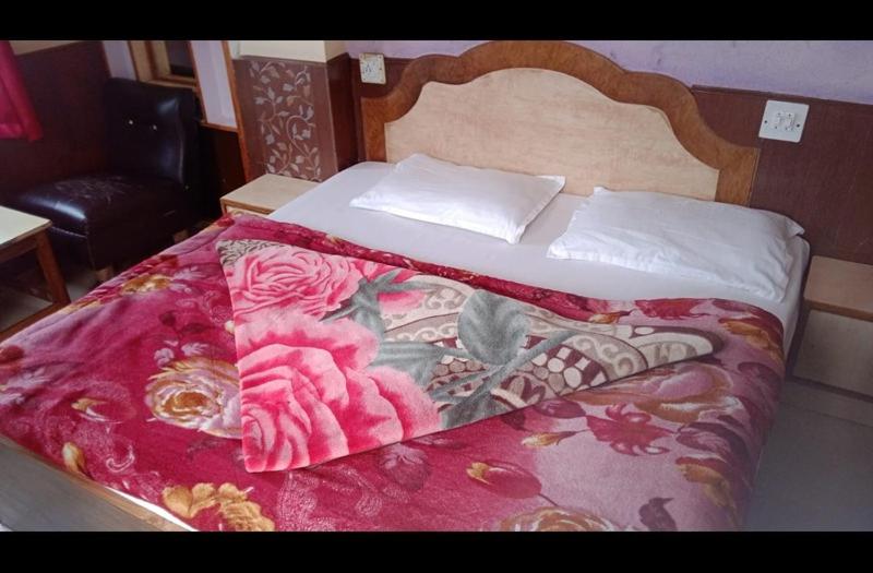 Postel nebo postele na pokoji v ubytování Hotel Harbans