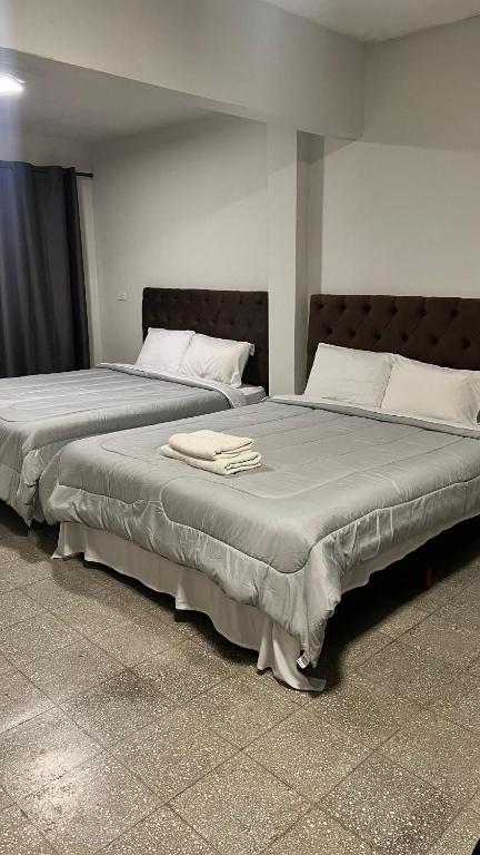 Postel nebo postele na pokoji v ubytování Hotel Herrera
