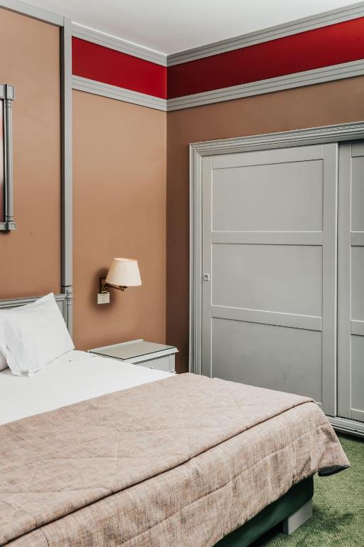Postel nebo postele na pokoji v ubytování Printania Palace Hotel