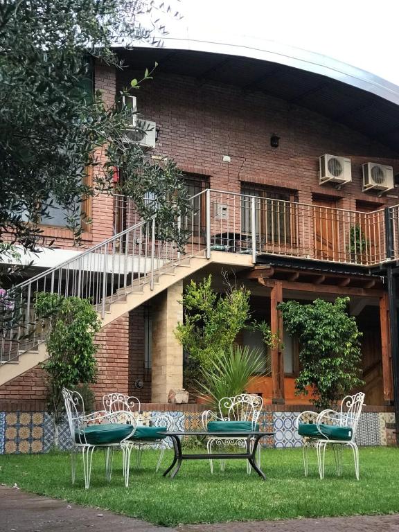 a group of chairs sitting in front of a building at Hotel Francia in San Rafael