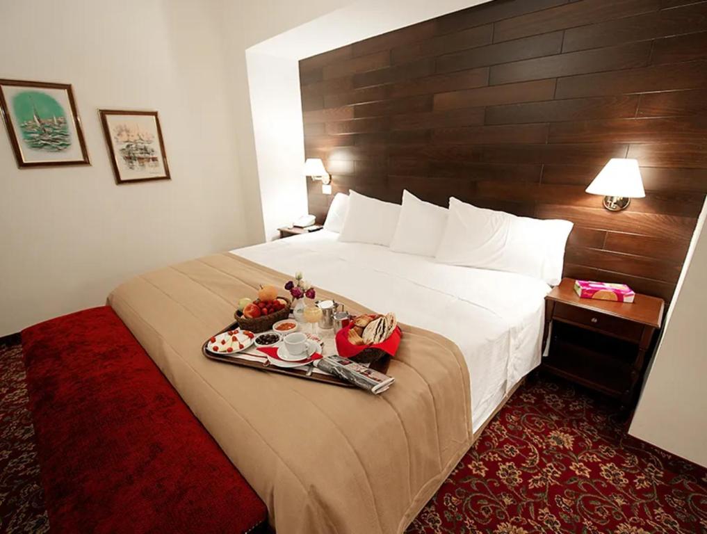 Postel nebo postele na pokoji v ubytování Printania Palace Hotel