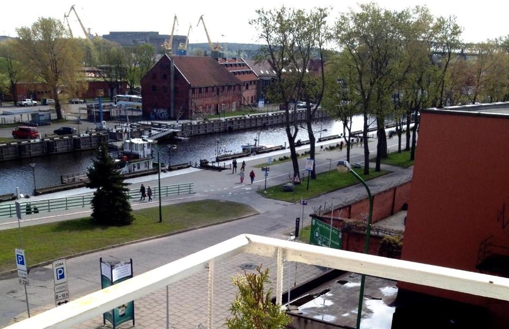 a view of a city with a river and buildings at Central Apartament in Klaipėda