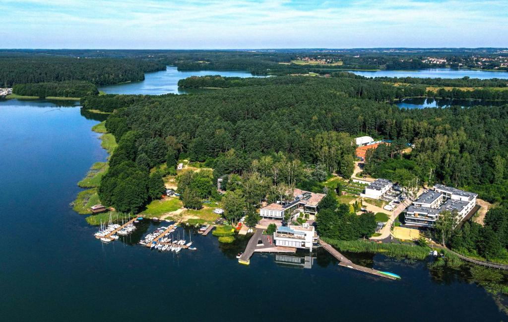 an aerial view of a large estate on a lake at Apartamenty Olimpijska by RENT4YOU in Olsztyn