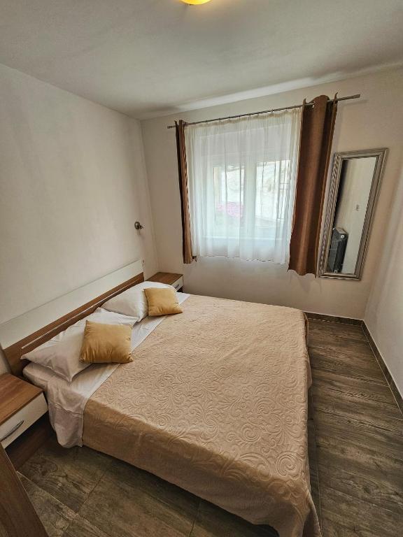 Postel nebo postele na pokoji v ubytování Apartments Plejic