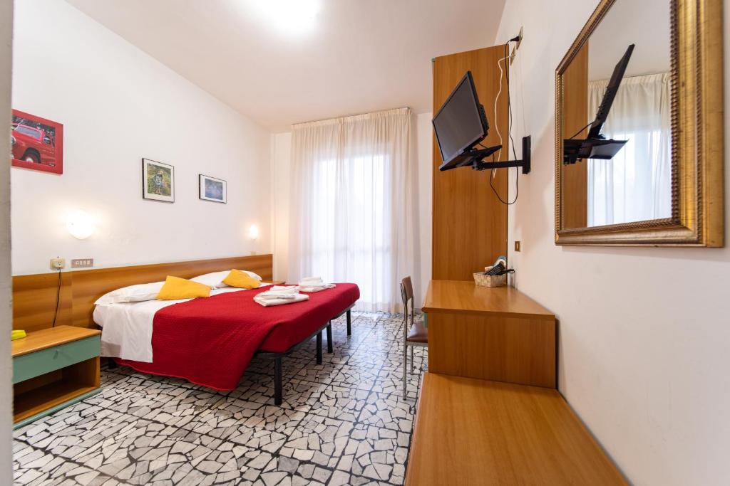 Postel nebo postele na pokoji v ubytování Hotel Cortina