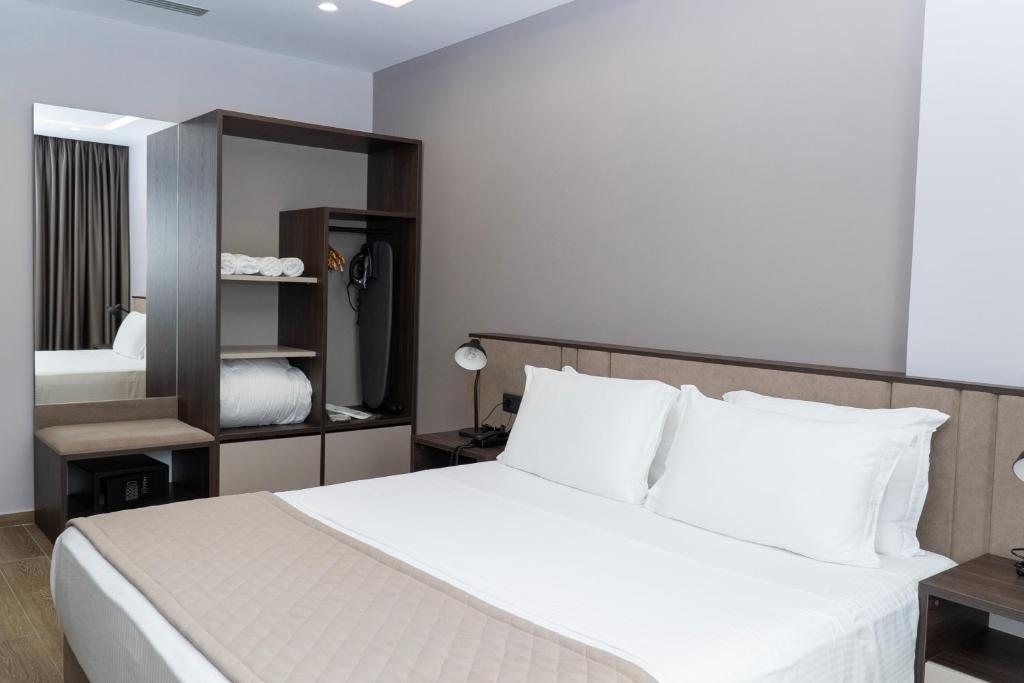Postel nebo postele na pokoji v ubytování Joelle Premium Hotel