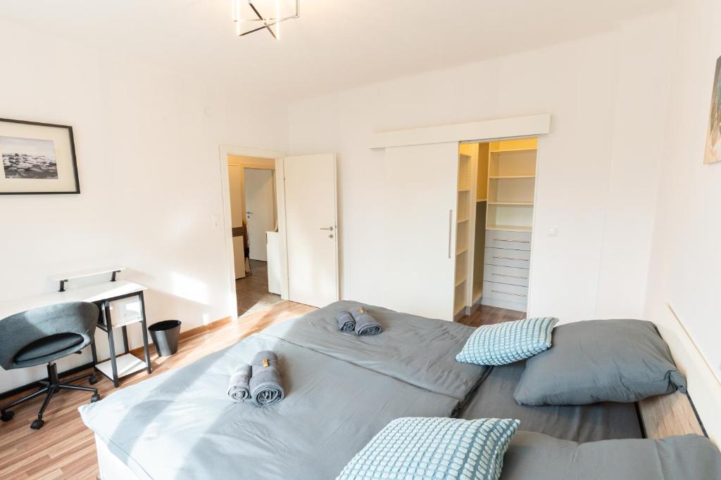 Postel nebo postele na pokoji v ubytování Gemütliche Wohnung im Trendviertel Lend