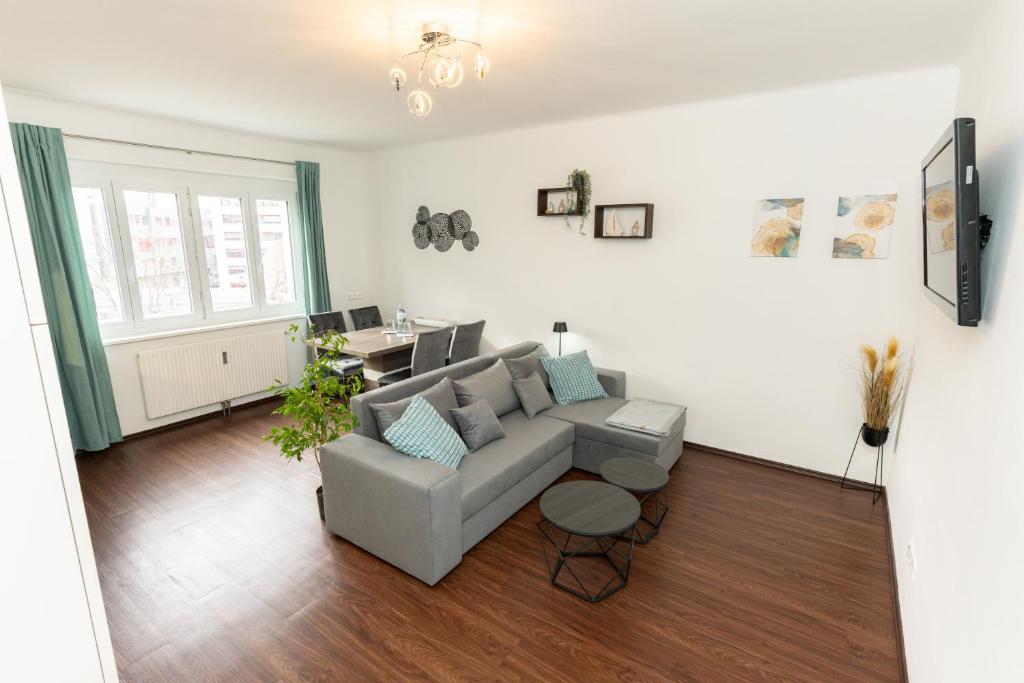 Posezení v ubytování Gemütliche Wohnung im Trendviertel Lend