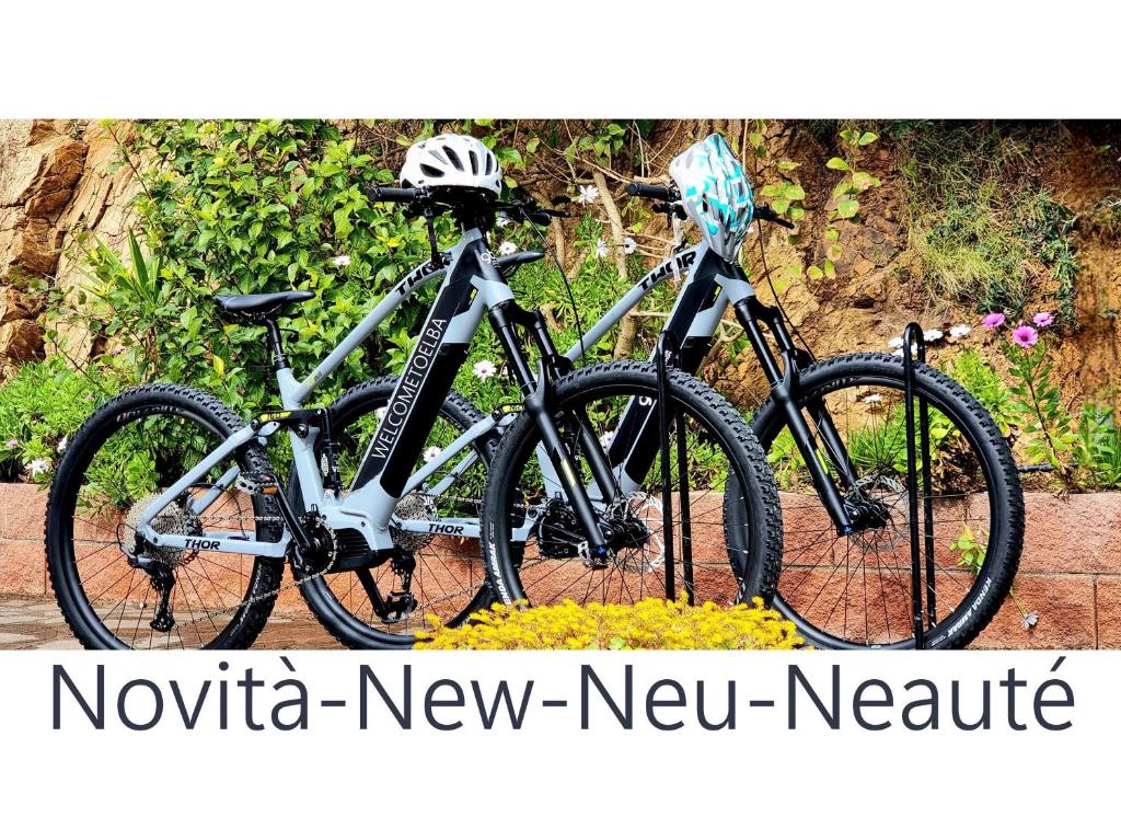 two bikes are parked next to each other at Eco Hotel Montemerlo in Fetovaia