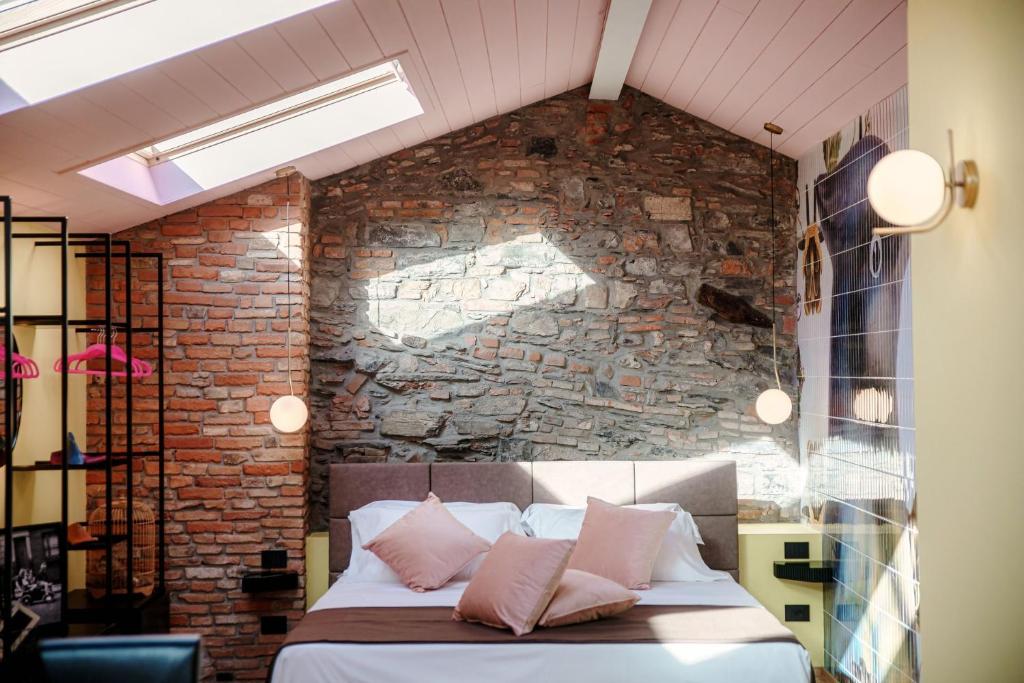 Postel nebo postele na pokoji v ubytování Aurum - Como Luxury Suites