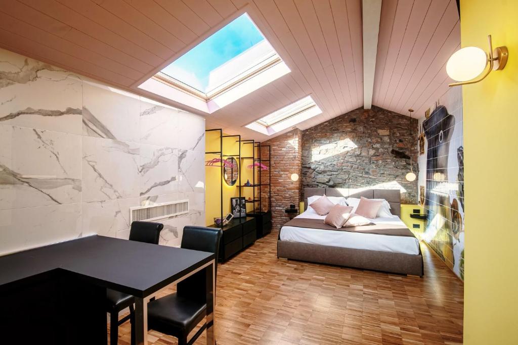 Postel nebo postele na pokoji v ubytování Aurum - Como Luxury Suites