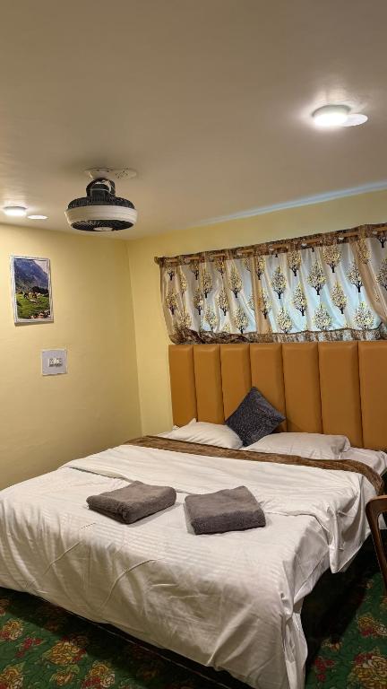 Postel nebo postele na pokoji v ubytování Al Hayat Guest House
