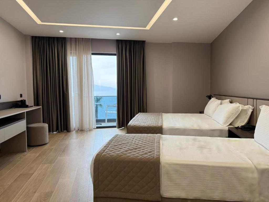Postel nebo postele na pokoji v ubytování Joelle Premium Hotel