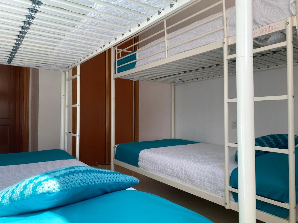 En eller flere senge i et værelse på Villa Belén playa , piscina privada