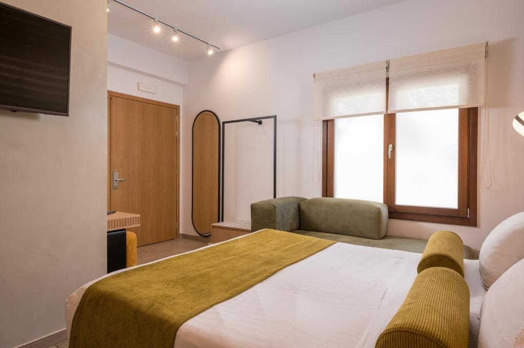 Łóżko lub łóżka w pokoju w obiekcie Agave Suites