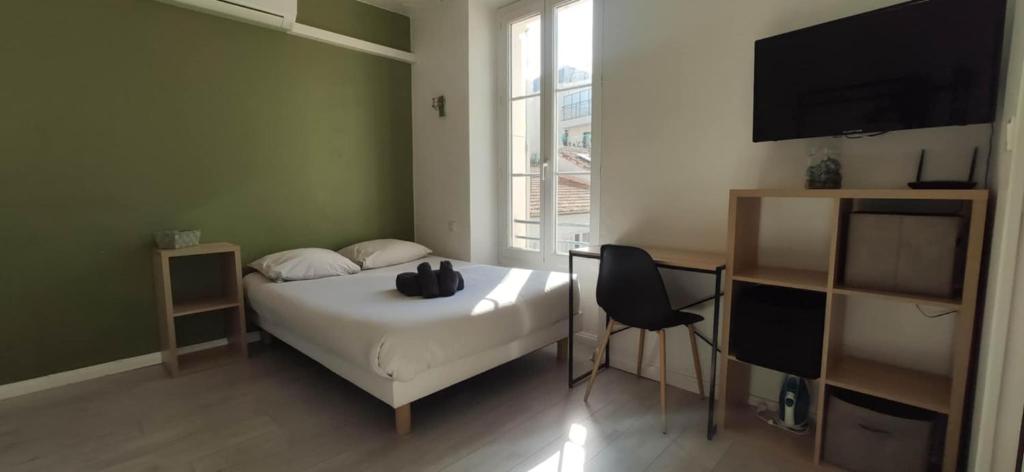 Postel nebo postele na pokoji v ubytování APPARTEMENT CANNES MONTFLEURY