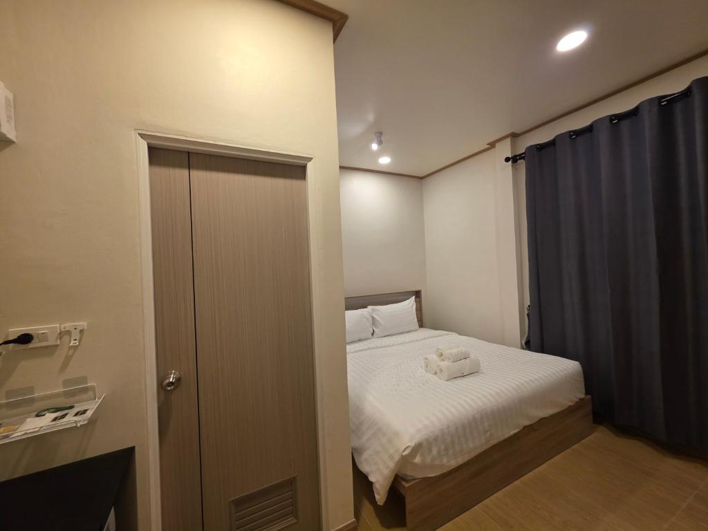 Giường trong phòng chung tại ASAP Boutique Phuket