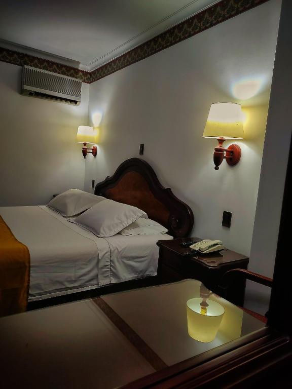 Postel nebo postele na pokoji v ubytování Gran Hotel