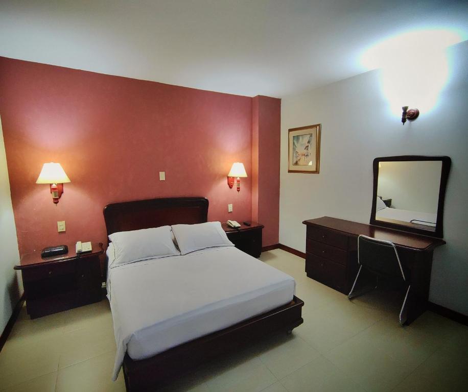 Postel nebo postele na pokoji v ubytování Gran Hotel