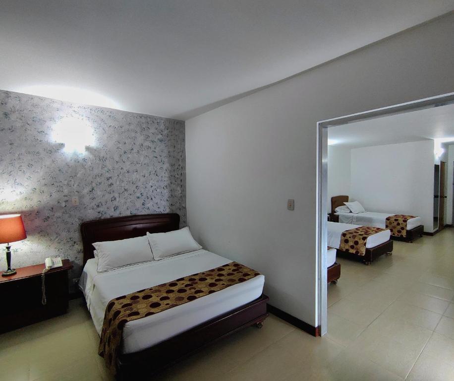 Postel nebo postele na pokoji v ubytování Gran Hotel