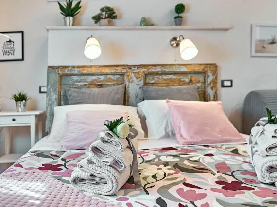 A bed or beds in a room at La Casina di Rosa