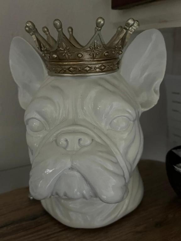 a statue of a dog with a crown on its head at Kelston Guest House in Weymouth