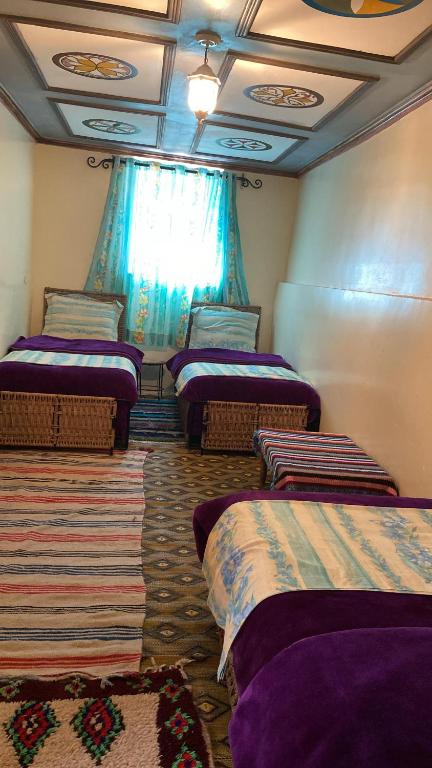 Voodi või voodid majutusasutuse Kasbah Ait Bouguemez toas
