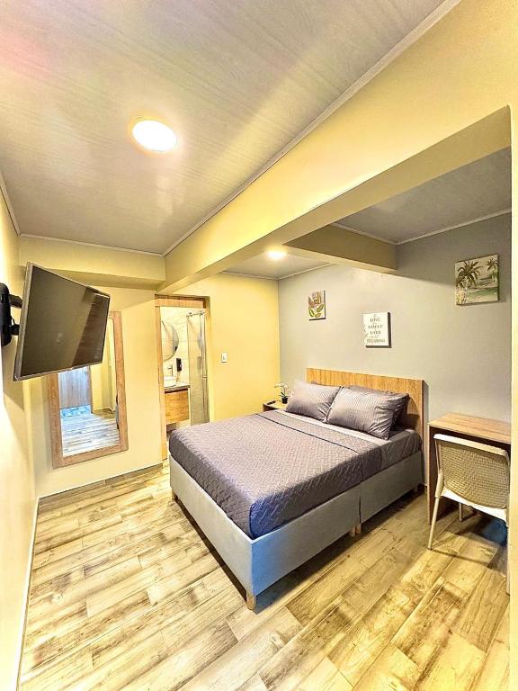 Postel nebo postele na pokoji v ubytování Hostelfc Santa Barbara