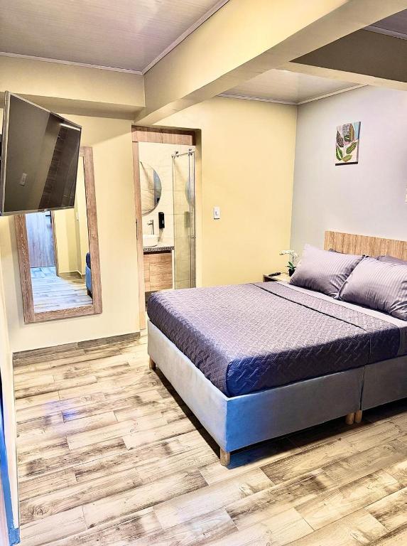 Postel nebo postele na pokoji v ubytování Hostelfc Santa Barbara