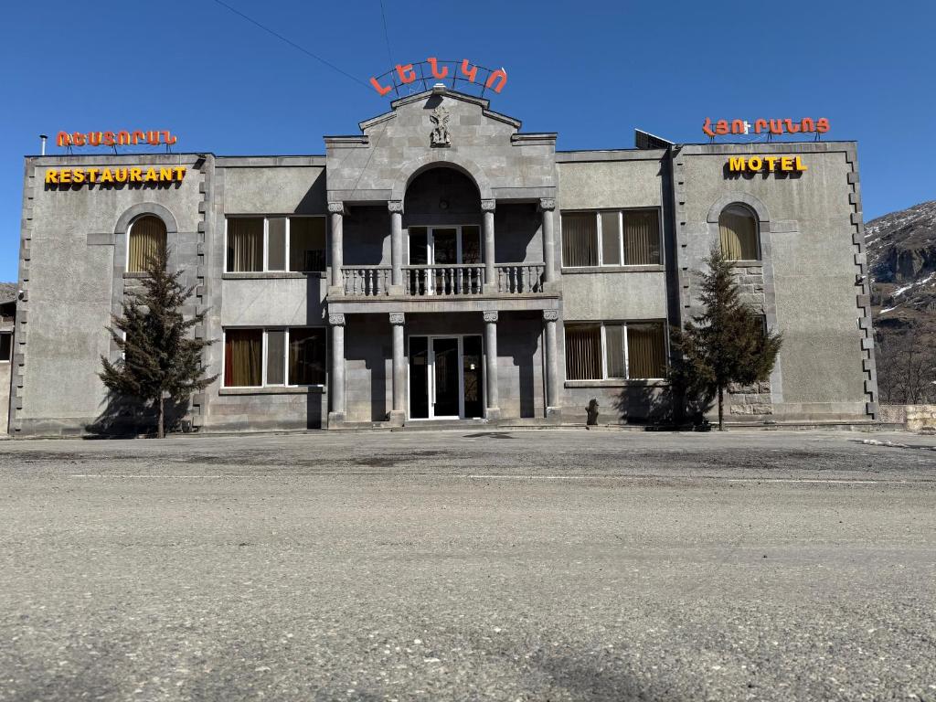 an old building with a balcony on top of it at Lenko in Goris