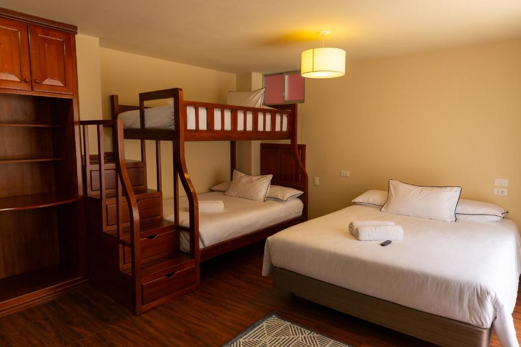 Postel nebo postele na pokoji v ubytování Hotel Casa Agave
