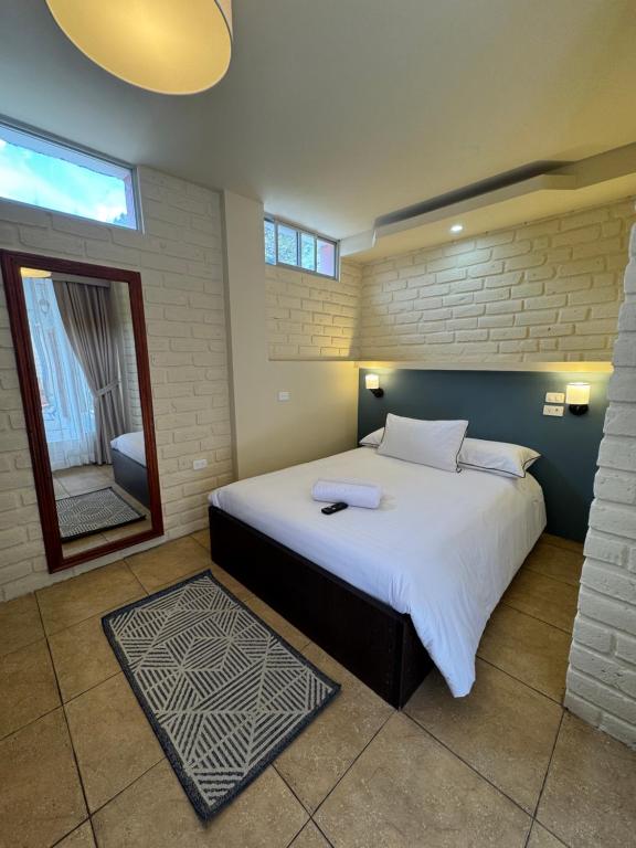 Postel nebo postele na pokoji v ubytování Hotel Casa Agave