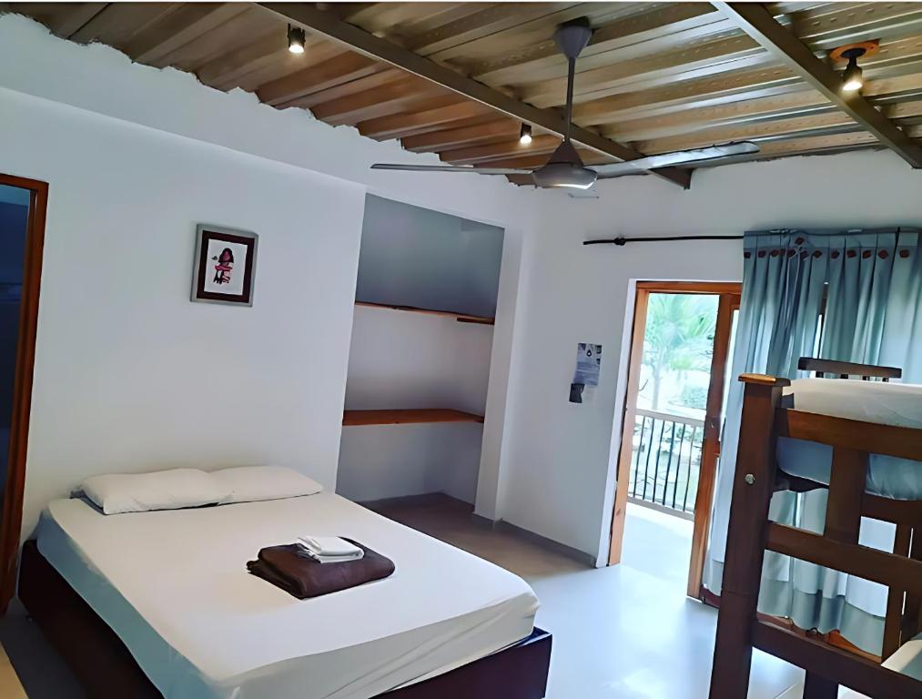Postel nebo postele na pokoji v ubytování Baobao Hostel Palomino