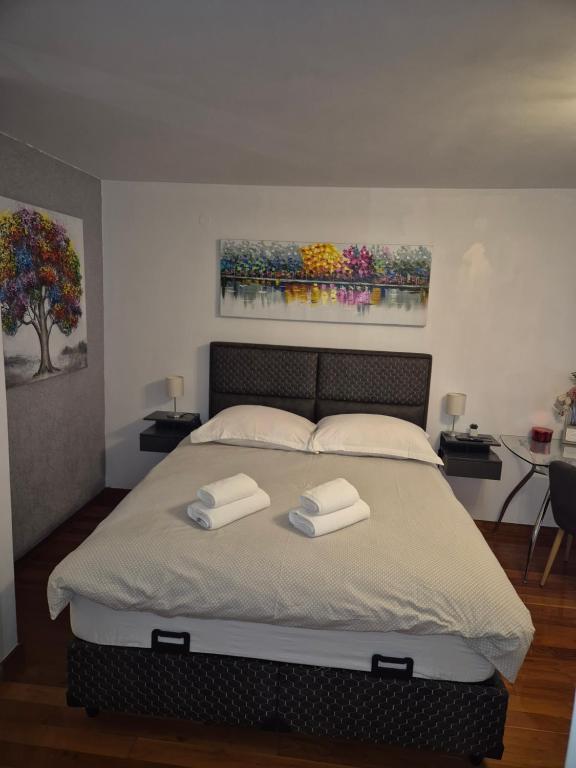 Posteľ alebo postele v izbe v ubytovaní ToMaDi Residence