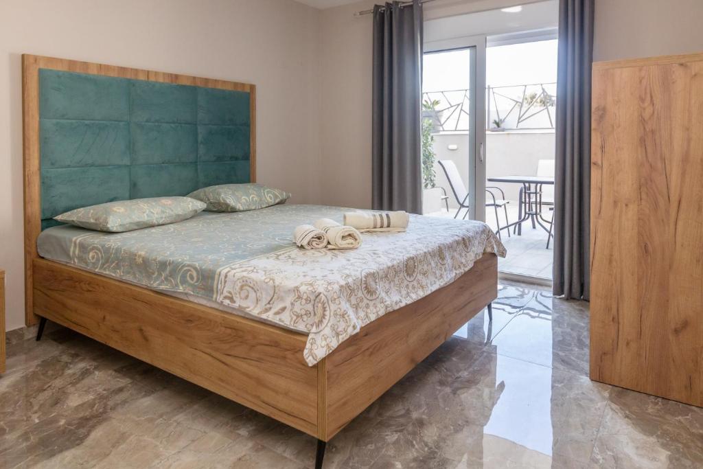 Postel nebo postele na pokoji v ubytování Apartments Posejdon Lux
