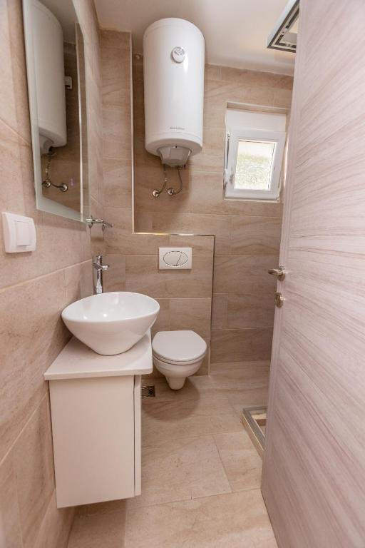 Koupelna v ubytování Apartments Posejdon Lux