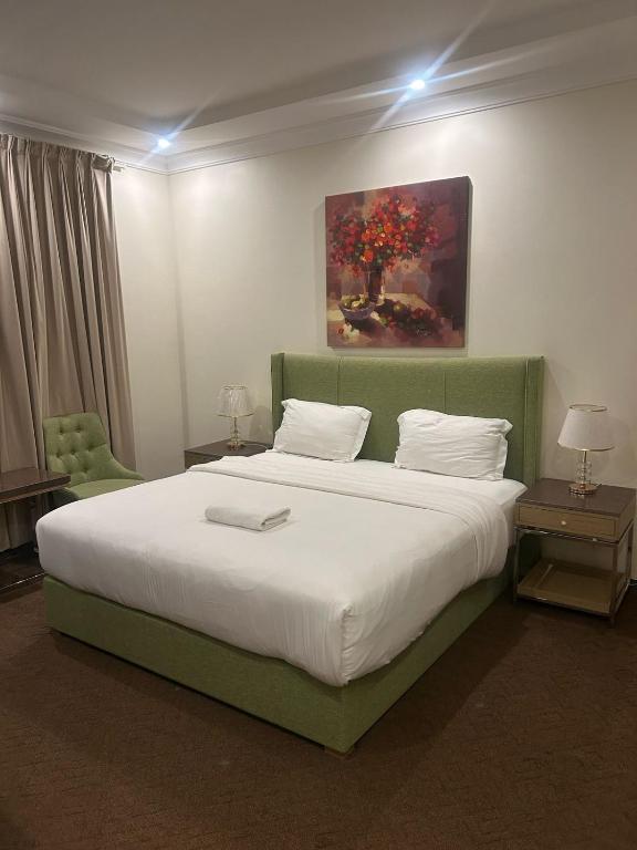 Postel nebo postele na pokoji v ubytování Aseel Hotel Apartment