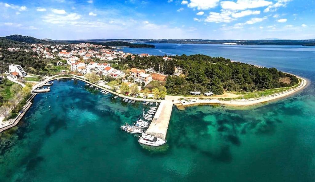an aerial view of a dock with boats in the water at Carpe Diem in Raslina