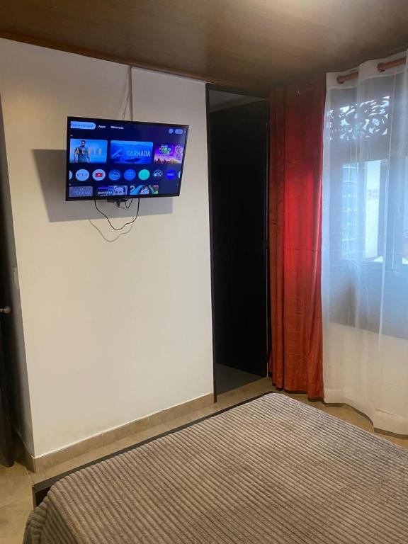 TV a/nebo společenská místnost v ubytování Destino Nómada Calle 11 n 1-38