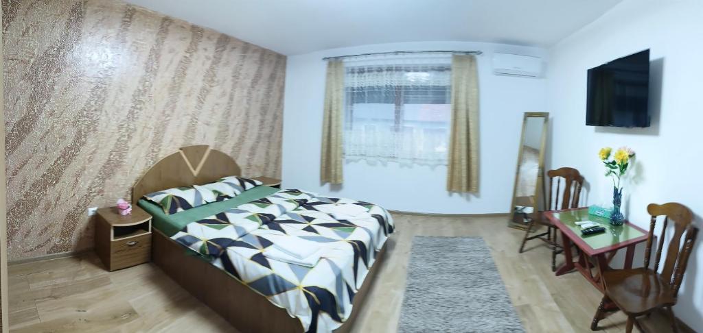 Postel nebo postele na pokoji v ubytování Casa Luminița