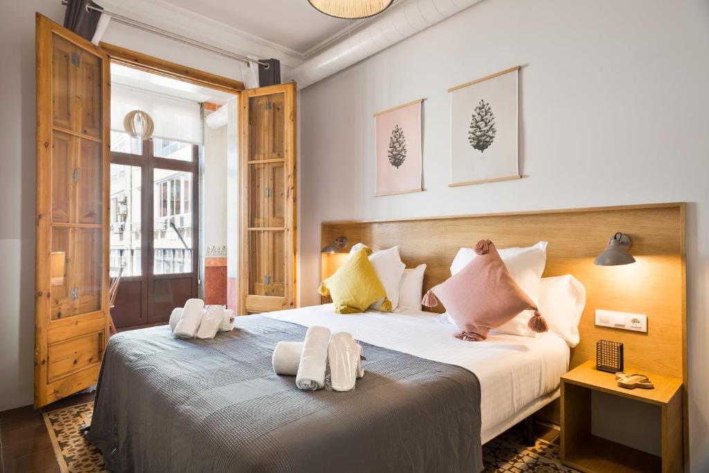Postel nebo postele na pokoji v ubytování Central Apartments Barcelona