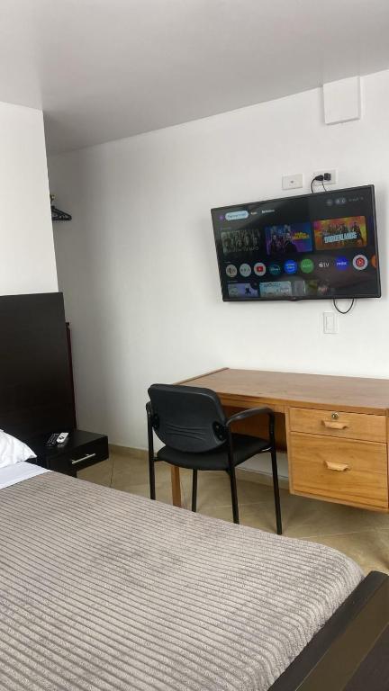 TV a/nebo společenská místnost v ubytování Destino Nómada Calle 11 n 1-38